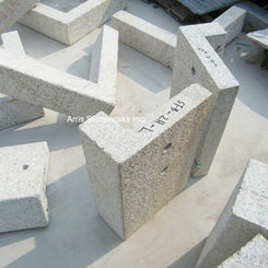 Technical assembly of thick-cut Gold Beige Granite blocks for custom architectural trim, highlighting the material's structural density and precise edge quality.