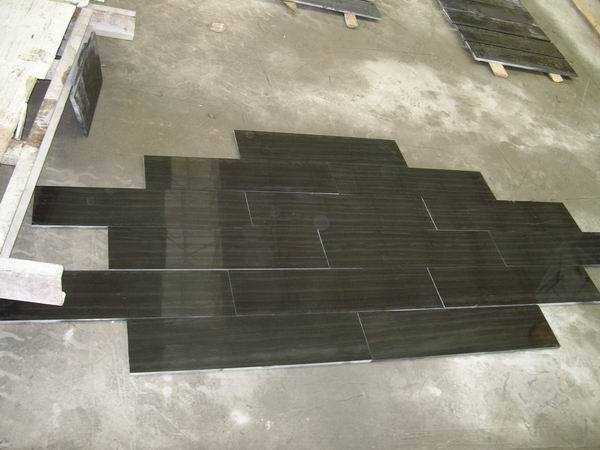 dry-lay of Black Wood Vein Limestone slabs, ensuring perfect alignment of the directional wood-like grain for large-format flooring or wall panels.