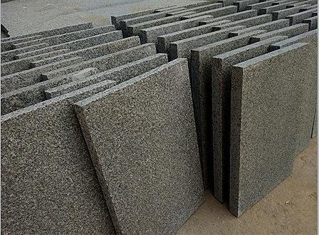 Pepper Corn Granite slabs, demonstrating uniform thickness and high-quality edge finishing for large-scale architectural facade projects."