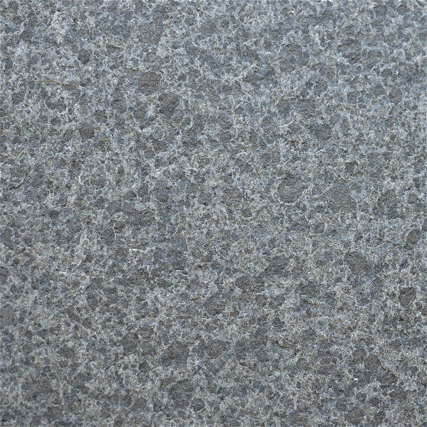 Flamed Obsidian Basalt offering a rugged, high-friction exterior texture that maintains a consistent charcoal-black palette for safe outdoor walkways and patios.