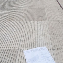 Large-scale dry-lay of Khaki Limestone floor tiles with architectural shop drawings, ensuring precise pattern alignment and natural fossil distribution.