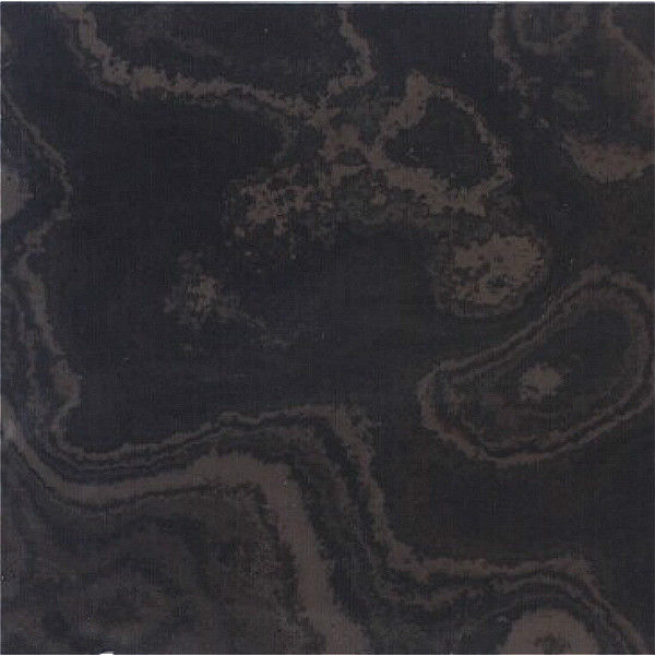 Honed Black Wood Vein Limestone showcasing a smooth matte surface with dramatic, flowing charcoal-and-grey mineral veining that mimics organic wood grain.