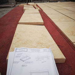 Precision-cut Sunny Beige Limestone architectural panels showing consistent golden tones and linear geometry.