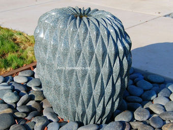 Detailed view of custom-carved granite elements and precision-joined stone panels for a landmark corporate fountain. Artist Cliff Garten