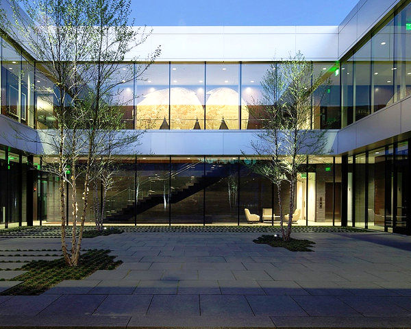 Exterior courtyard at the Harbor Office project featuring Black Galaxy Granite accents, showcasing the material's refined presence in contemporary commercial landscape architecture