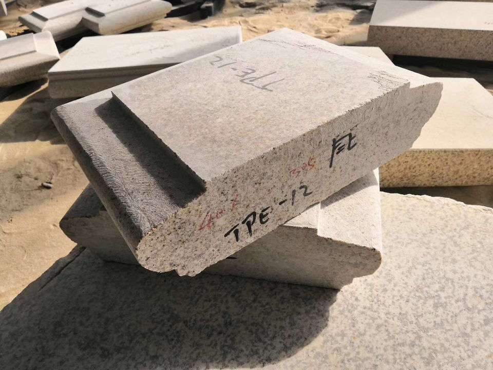 Heavy-duty Tuscan Granite threshold with a finished edge, showcasing the material's dense grain and golden-yellow tonal variations for entryways.