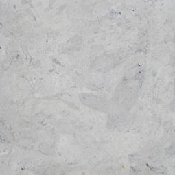 Harbor Grey Limestone with a smooth honed finish, showcasing a layered grey palette with silver undertones and bold mineral movement.