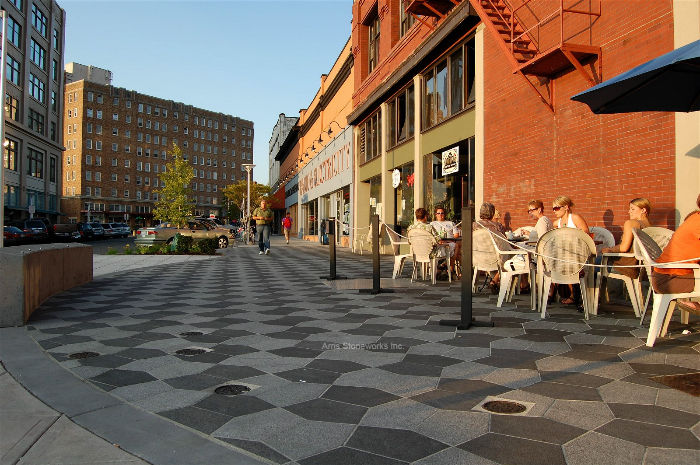 Geometric street paving in Bellingham featuring Obsidian Basalt accents, illustrating the stone's high-traffic durability and its role in creating bold, modern urban patterns.
