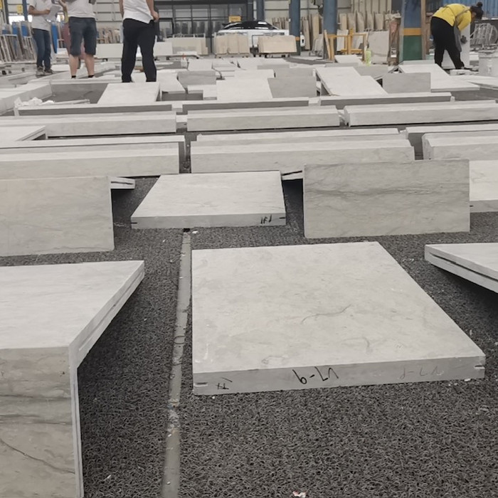 Heavy-duty Harbor Grey Limestone blocks arranged for shipping, showcasing the stone’s dense structure and expressive natural grey tones.