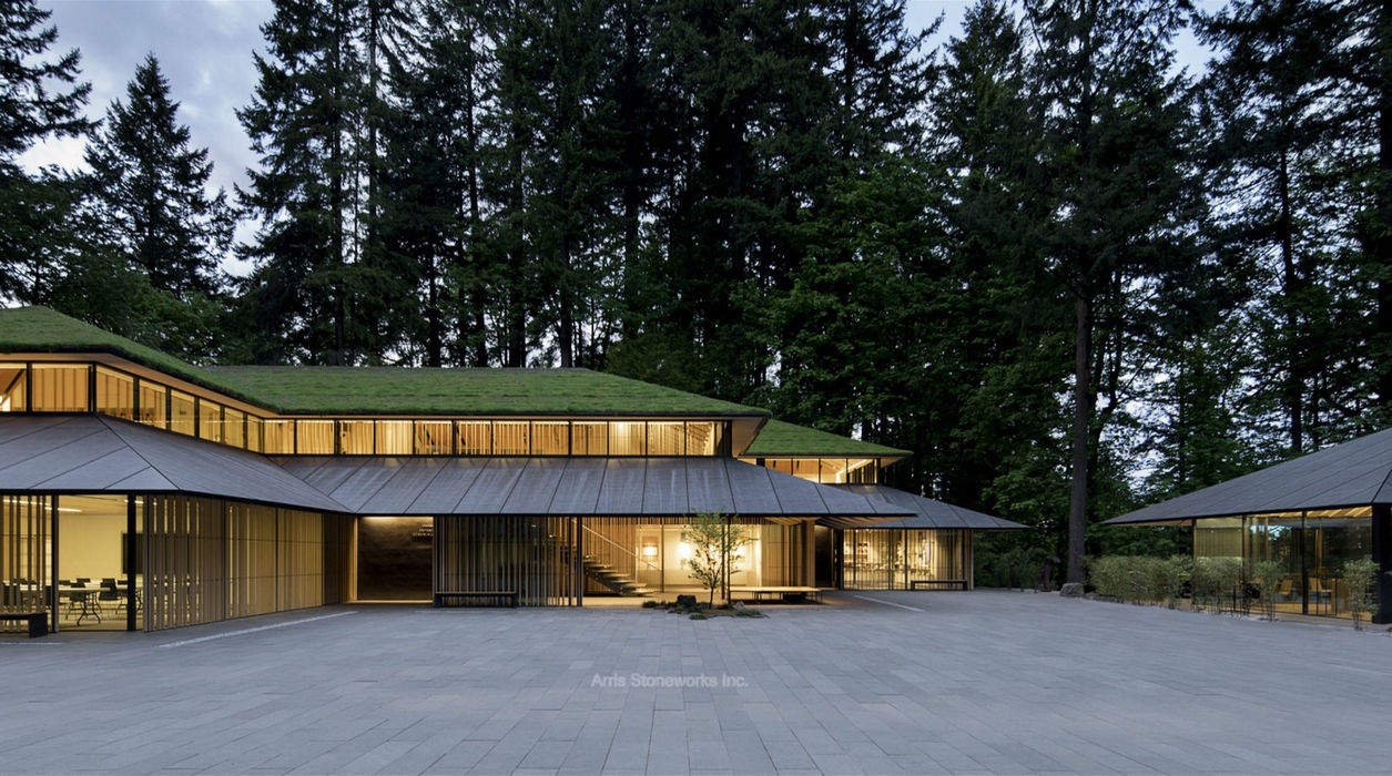 Wide view of the Obsidian Basalt stone courtyard and Cultural Village buildings at the Portland Japanese Garden.