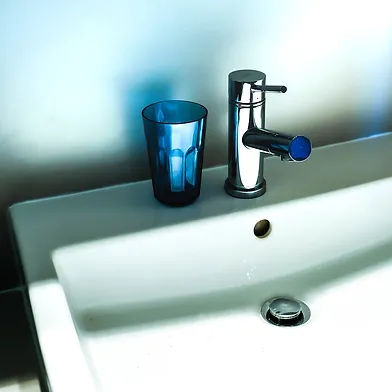Bathroom tap and cup