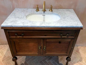 the vintage wooden cabinet converted to a vanity