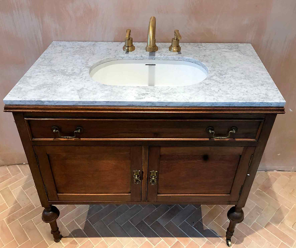 the vintage wooden cabinet converted to a vanity