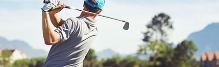 Golfer hitting golf
