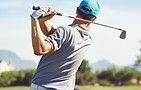 Golfer hitting golf