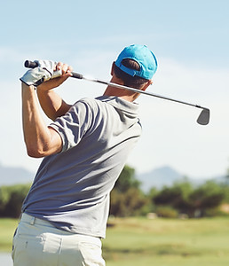 Golfer Swinging Club