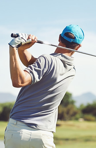 Golfer hitting golf