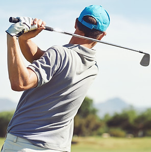 Golfer hitting golf