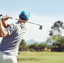 Golfer hitting golf