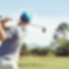 Golfer hitting golf