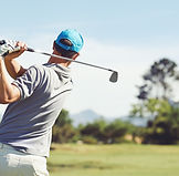 Golfer hitting golf
