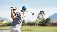 Golfer hitting golf