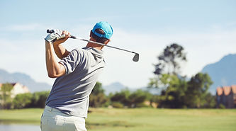 Golfer hitting golf