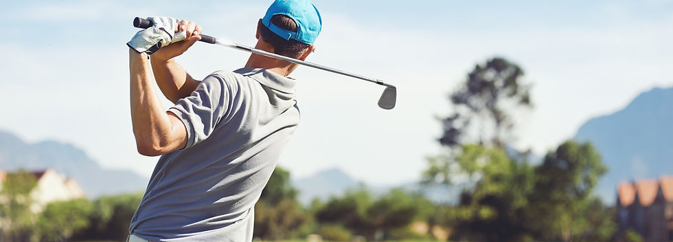 Golfer hitting golf