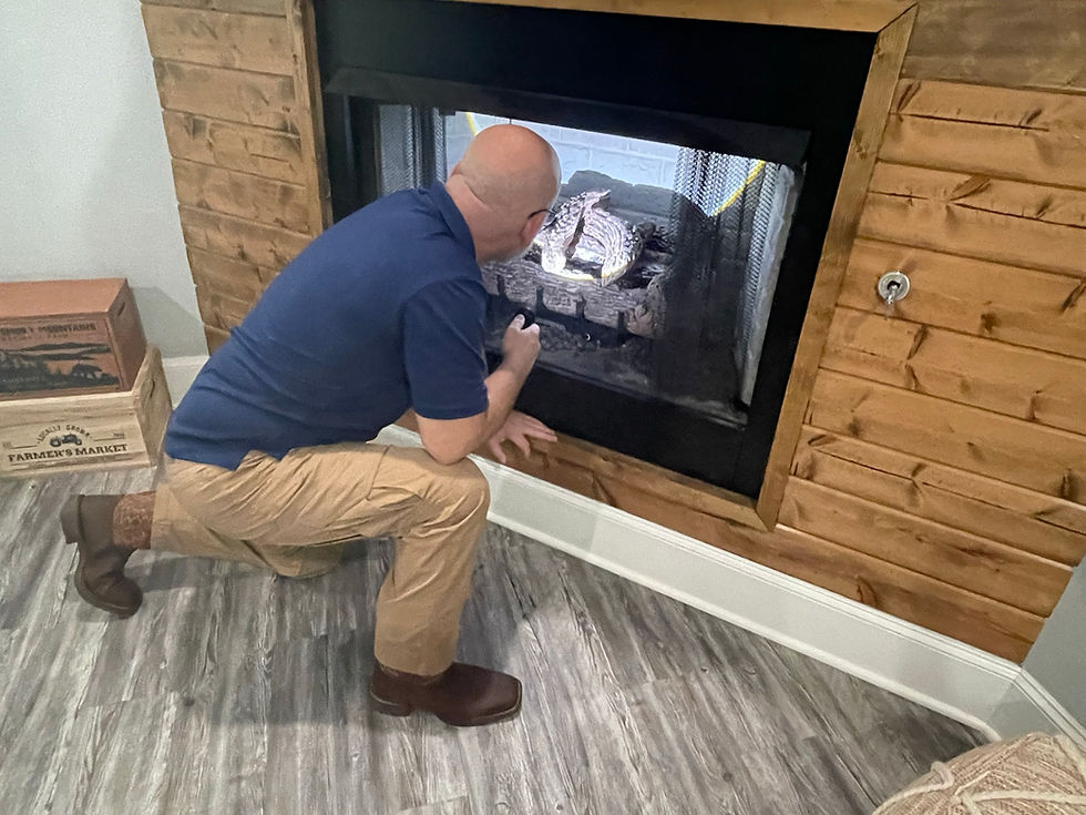 Man inspecting a fireplace