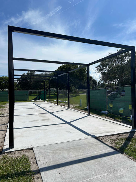 Black metal pergola frame on concrete