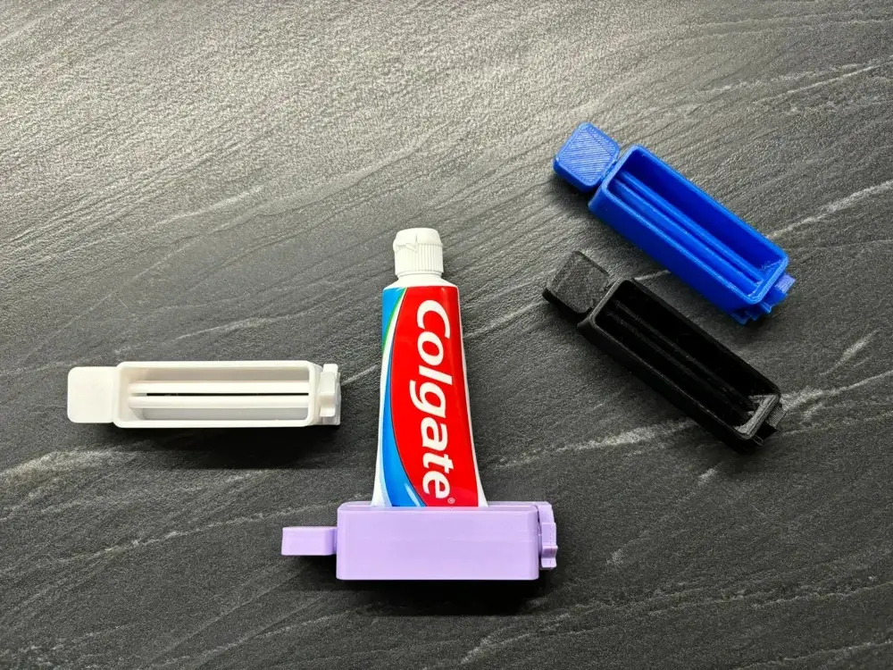 Ratcheted Toothpaste Squeezer And Upright Tube Stand Black