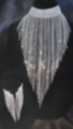 Eye-level view of Splendor choker necklace on a jewelry stand