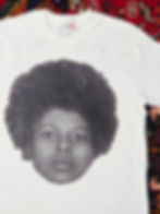 Thumbnail: Close up of Young Assata Shakur on white t-shirt
