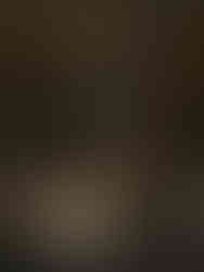 Romantic reception dinner tables with sculptural coral florals and candlelight inside Monserate Winery’s barrel room.