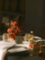 European-inspired ceremony setup with coral-toned aisle florals framing the seating at Monserate Winery.