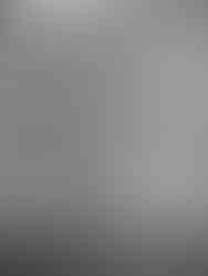 Bride’s lace wedding gown and bridesmaids’ dresses hanging on a modern clothing rack in Monserate Winery bridal suite.