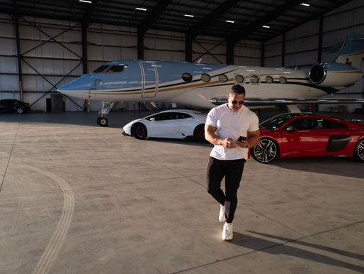 CEO exits black luxury vehicle at Austin-Bergstrom Airport, showcasing Caliber’s discreet, executive transport with concierge-level service.