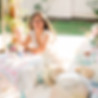 Custom white floral arch by Austin wedding florist at luxury outdoor ceremony