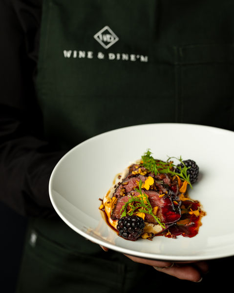 Brisbane studio food photography of stunning veal dish held by member of staff
