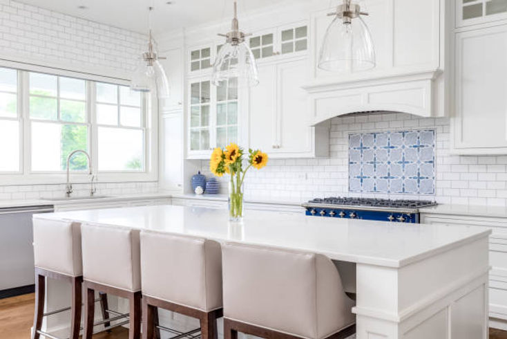 a-white-kitchen-with-a-large-island-and-tiled-backsplash.jpg_s=612x612&w=0&k=20&c=ng3ORxrf