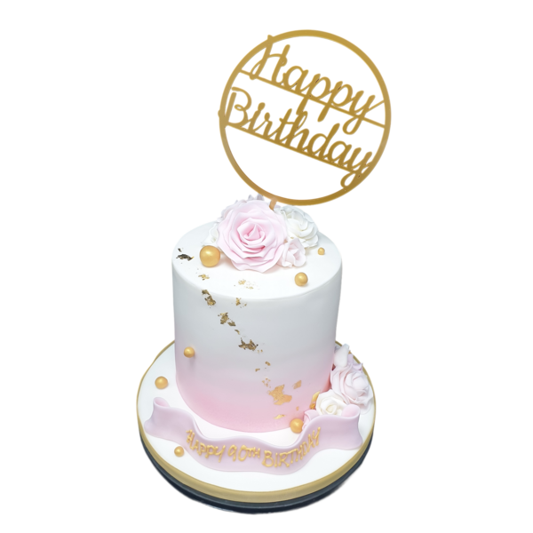 Luxurious golden cake topped with elegant decorations, perfect for special occasions and celebrations.