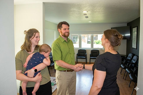 Dr. Lacey providing pediatric and family chiropractic care in Waterloo, IA