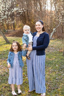 mother, daughter and son posing for a family photo in a Spring park