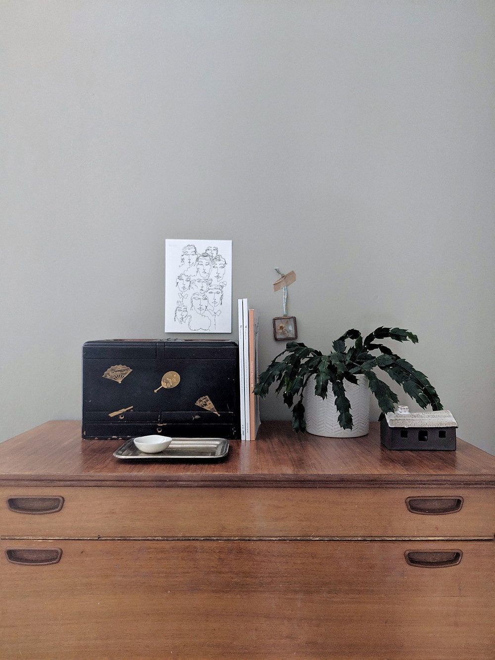 top of chest of drawers styling. Black box, plants, Katie Barclay print, Foxed ceramic bothy.