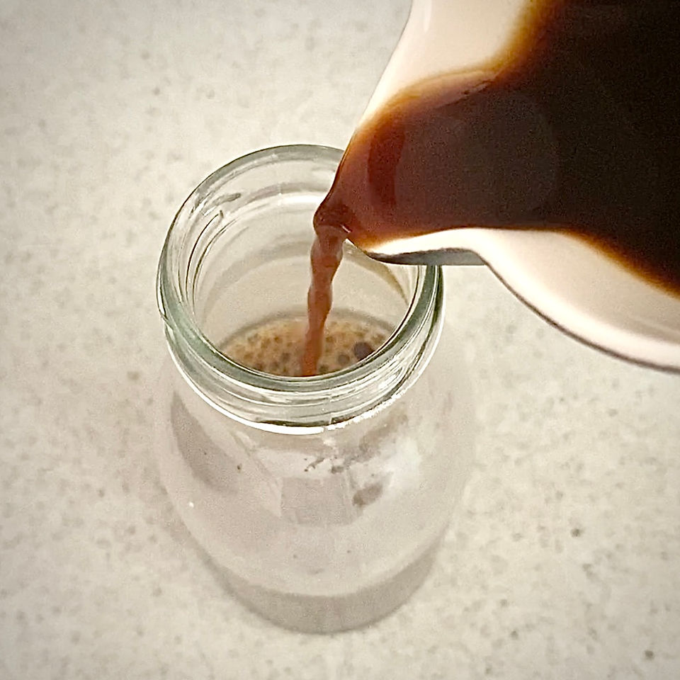 alder cone ink pouring into ink bottle