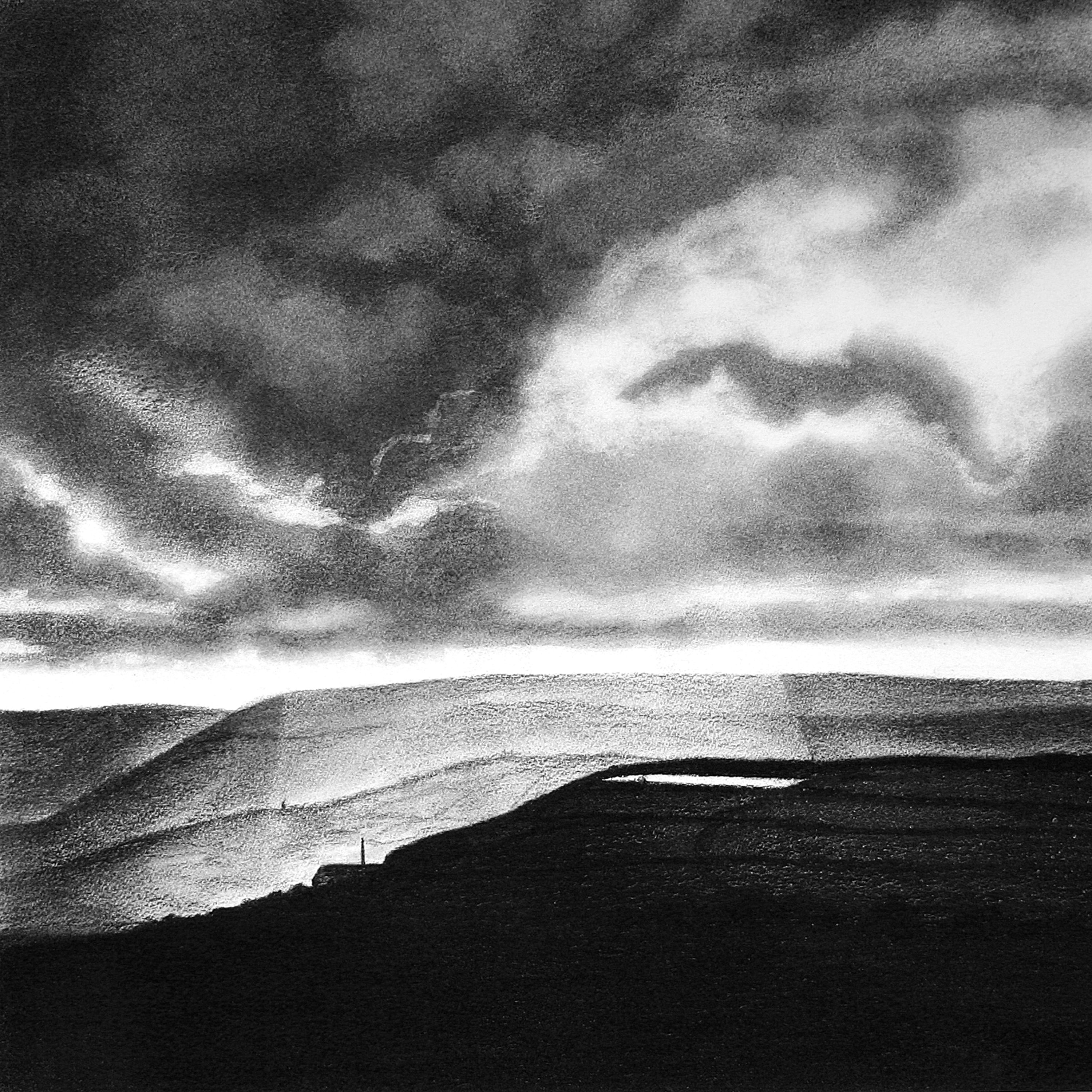 Dramatic cloudy sky with sun rays looms over a dark silhouetted hillside and reservoir in Calderdale. Pale distant hills.