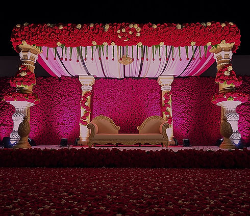 Indian wedding stage decoration with more flowers red theme close 10000 red roses in the b