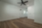 Room with wood floors, fan, part of a senior living project