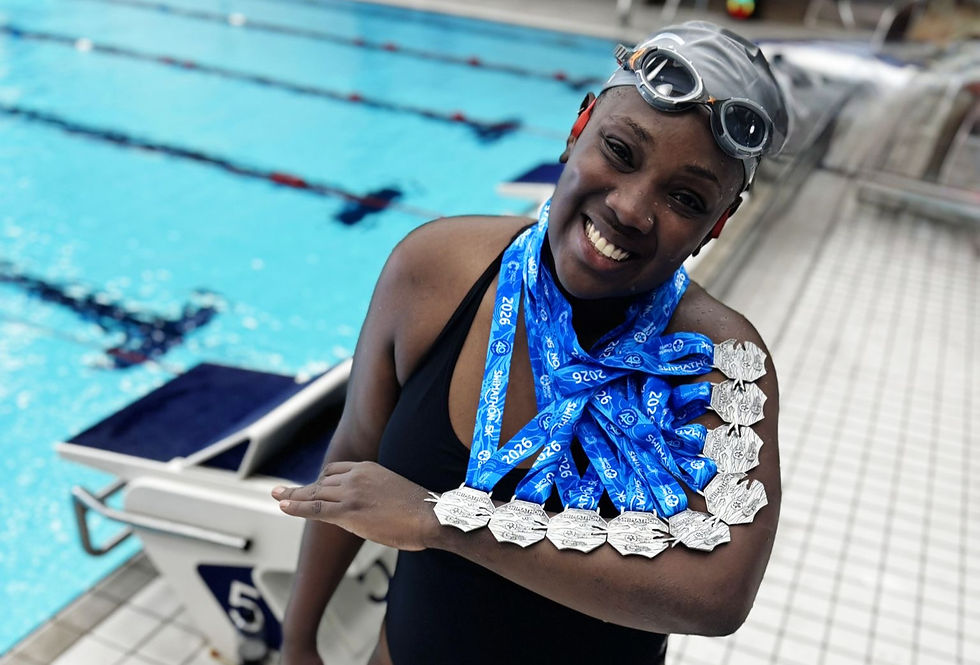 Naomi beams with pride at the London Aquatics Centre, showcasing her impressive array of medals after completing the last 5K swim. A true testament to resilience and achievement!