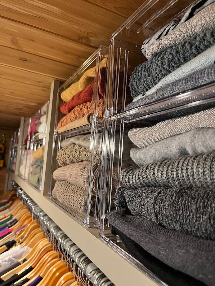 Use stackers or dividers to keep your sweaters from falling over.